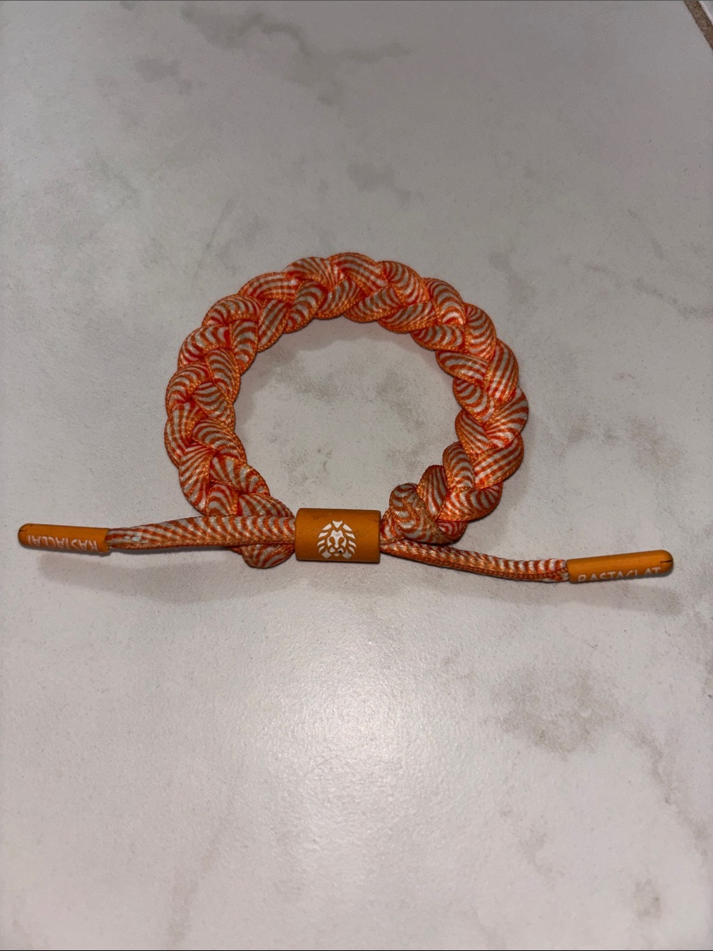 Adjustable Orange Braided Hair Tie with Logo Slider